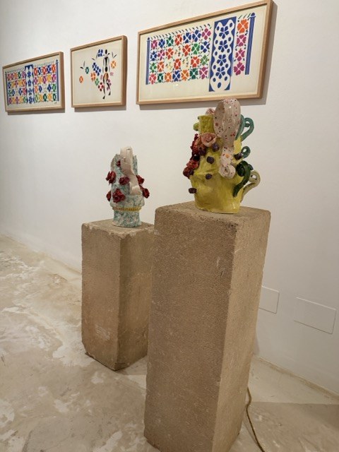 Colourful tiled artworks and sculptures on plinths at Nit de l'Art