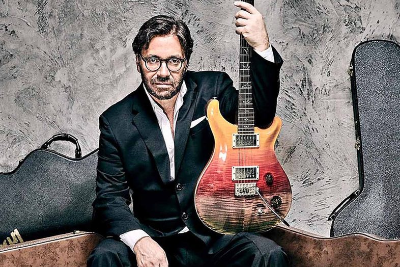 Guitarist Al Di Meola holding an electric guitar, Jazz Voyeur Festival, Inca
