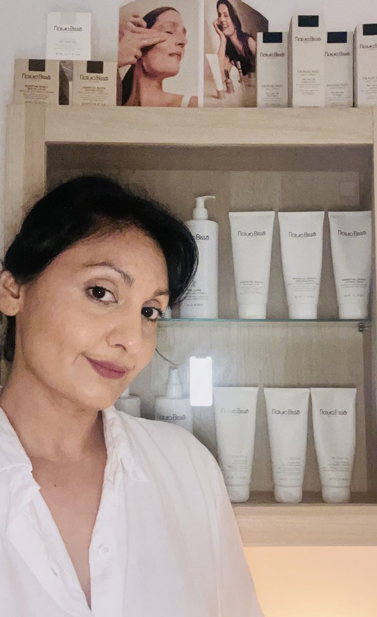 Jas Panesar of Sacred Space Palma with Natura Bissé skincare products