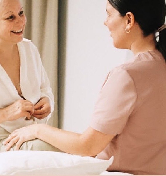 Therapist listening to a client during a wellbeing consultation