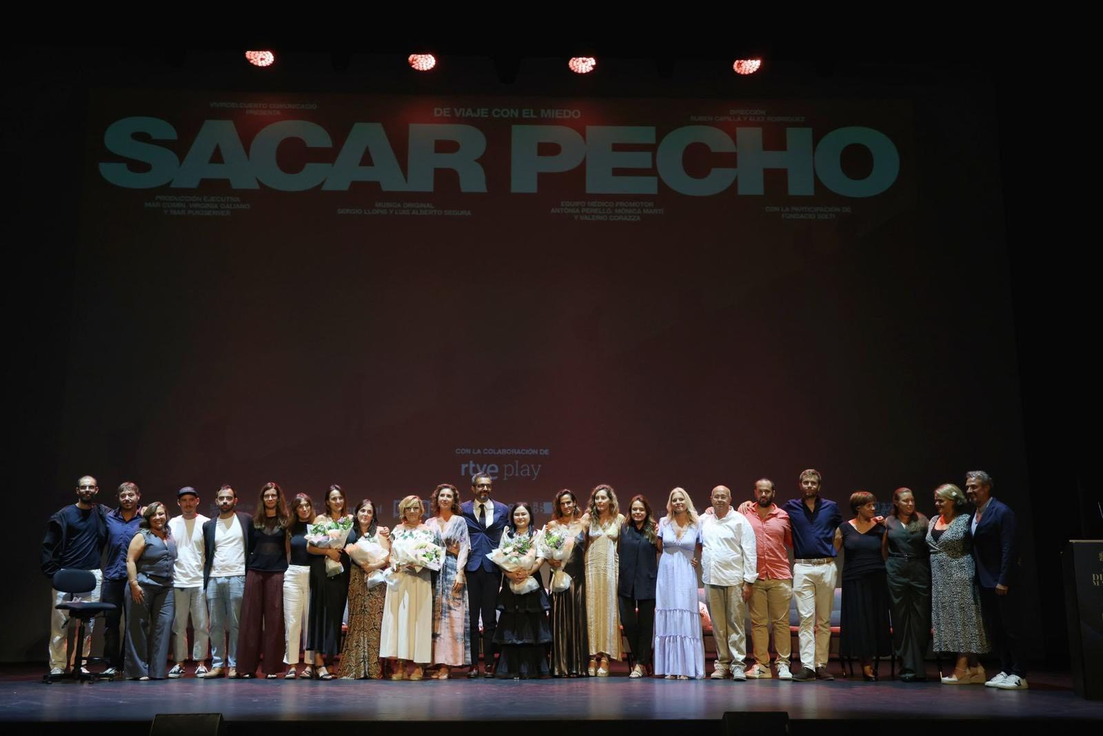 Cast, crew and medical team of the Sacar Pecho breast cancer documentary on stage at the Teatre Principal de Palma, Mallorca