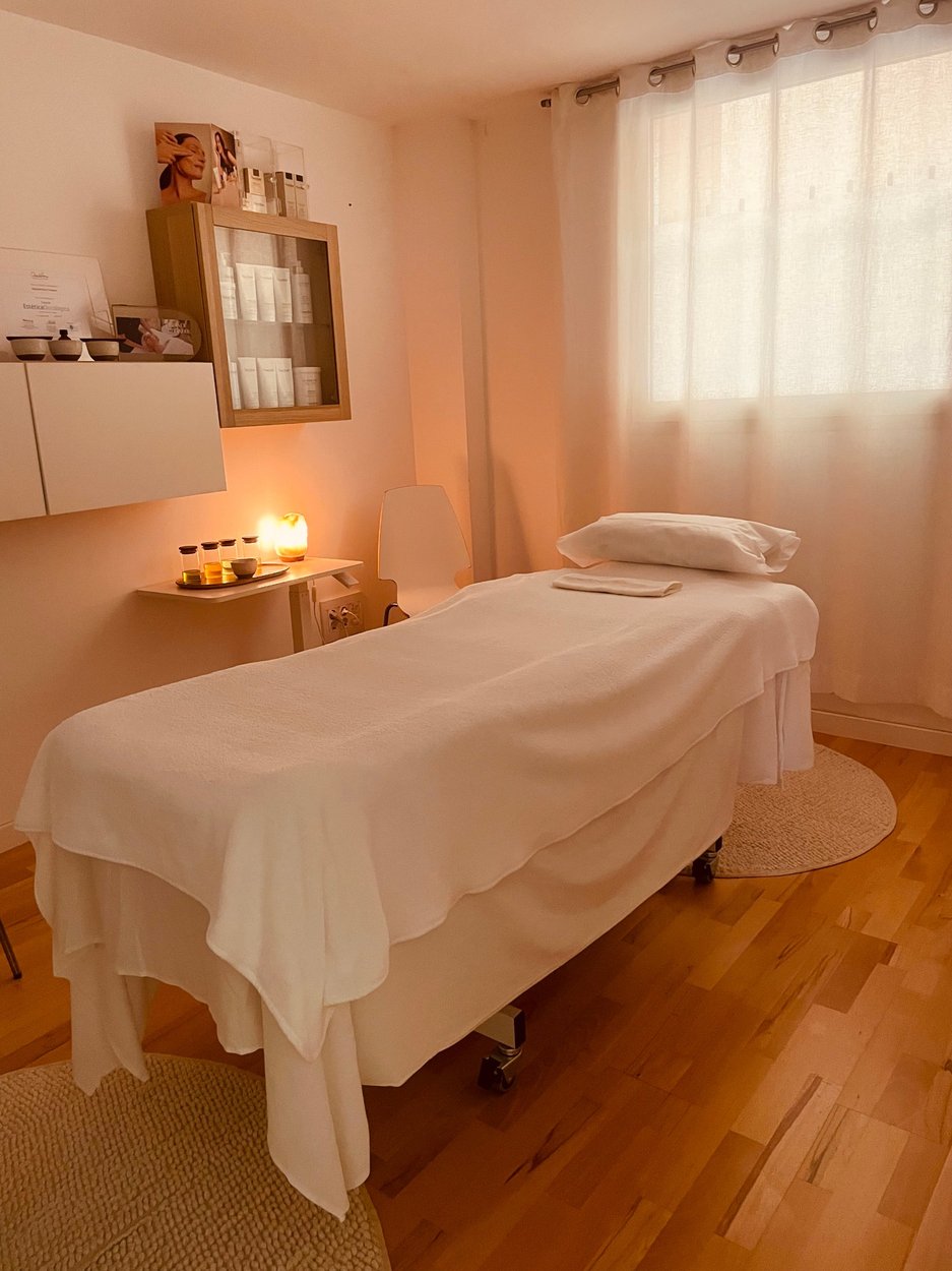 Calm, candlelit treatment room at Sacred Space Palma with Natura Bissé products and soft natural light, Mallorca