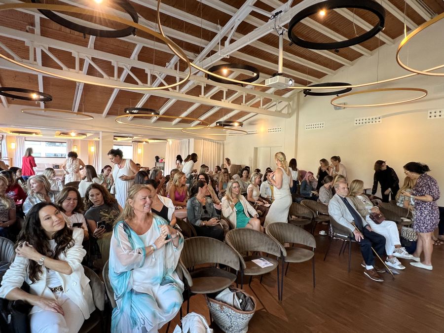 Audience of women listening to a talk at a women's health conference in Mallorca